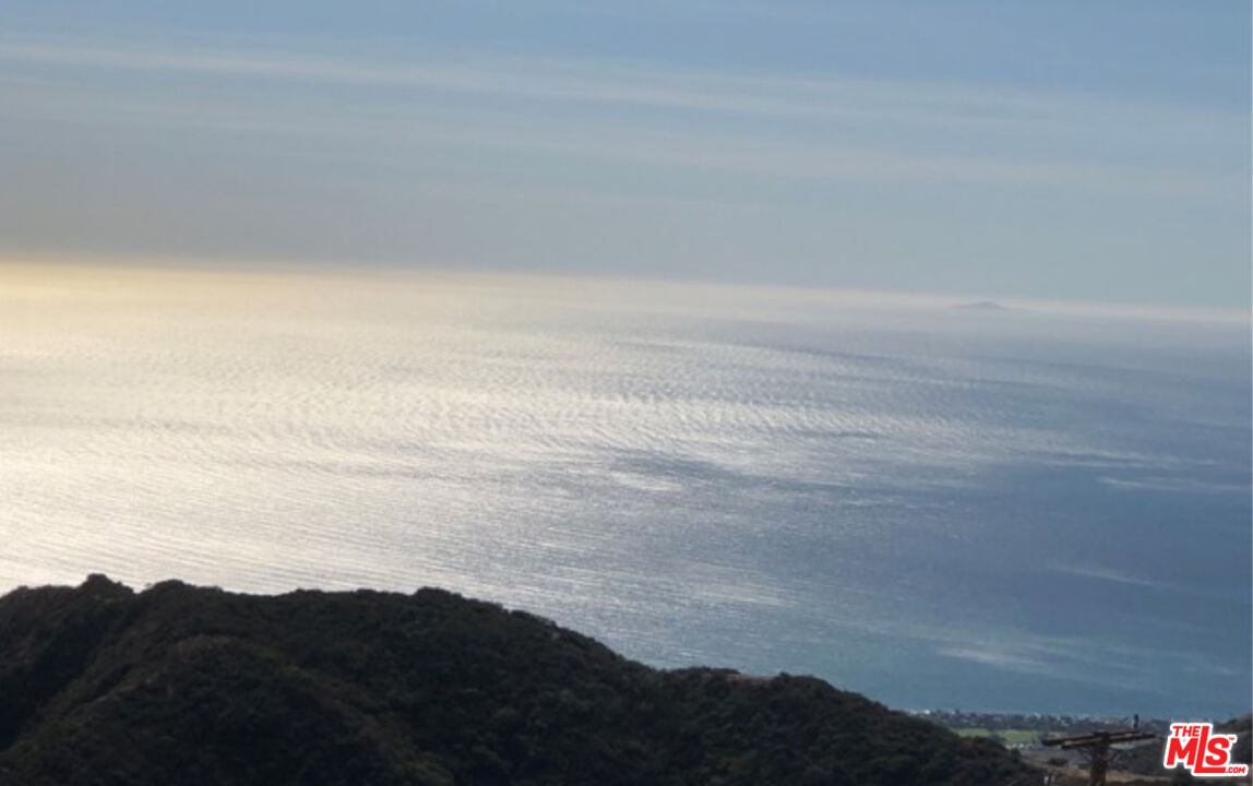 a view of beach and mountain