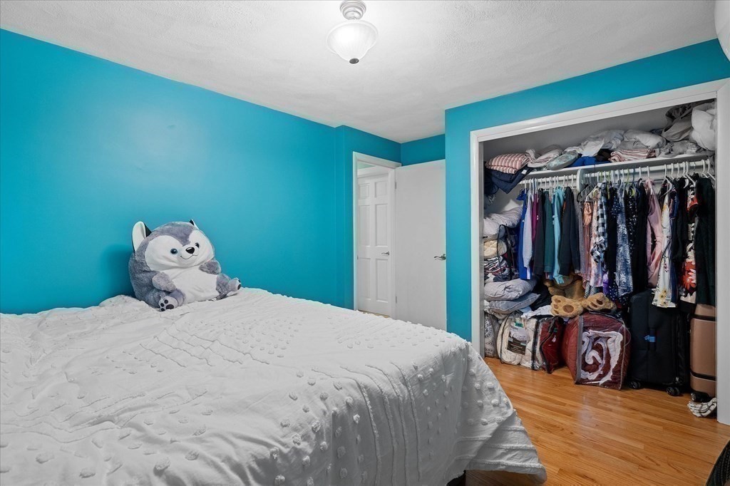 6 Nancy Drive Auburn, MA 01501 - Photo 17 of 27 a bedroom with a bed a large window and dresser