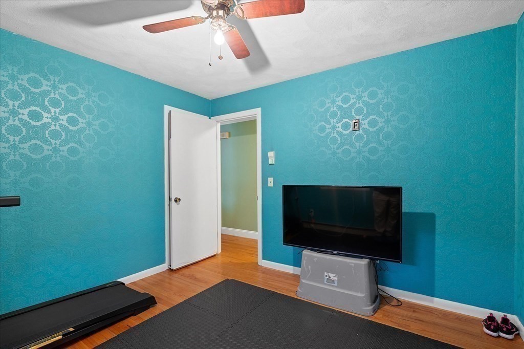 6 Nancy Drive Auburn, MA 01501 - Photo 19 of 27 a living room with furniture and a flat screen tv