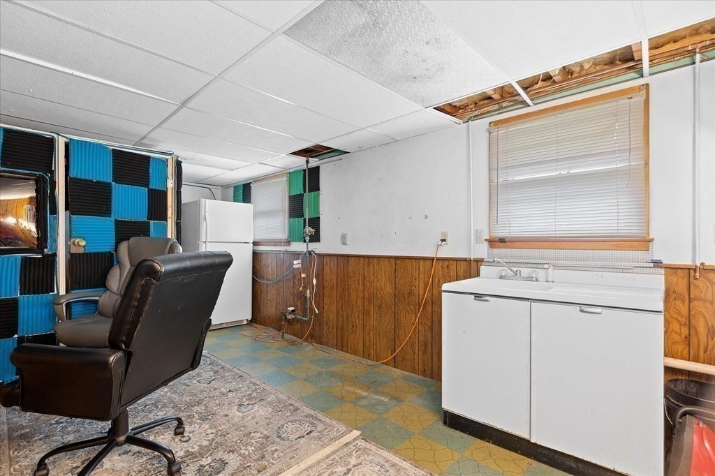 6 Nancy Drive Auburn, MA 01501 - Photo 20 of 27 a living room with furniture and kitchen view
