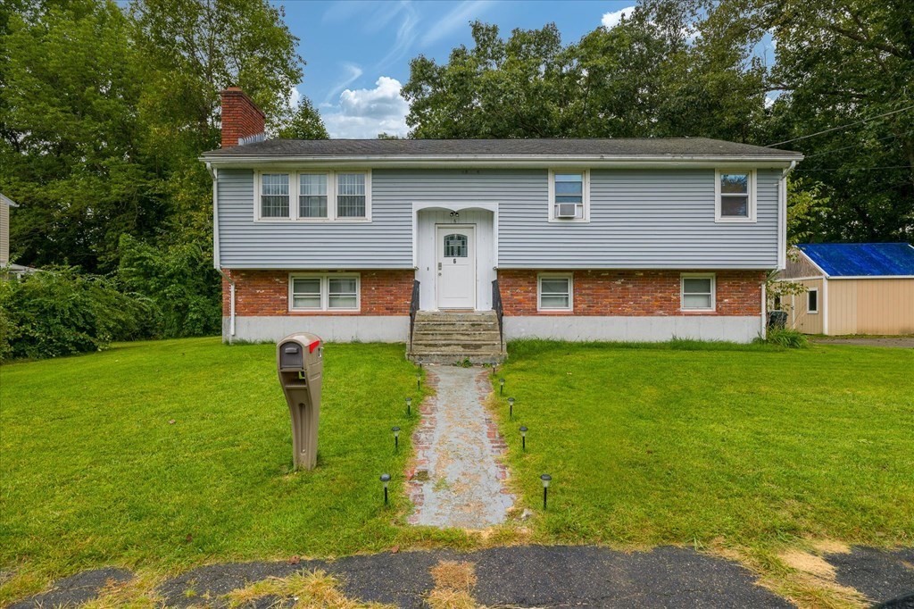 6 Nancy Drive Auburn, MA 01501 - Photo 2 of 27 a front view of house with yard and green space