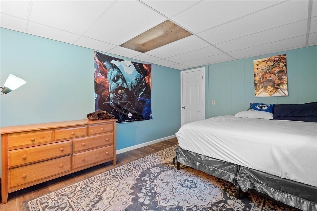 6 Nancy Drive Auburn, MA 01501 - Photo 23 of 27 a bedroom with a bed and painting on the wall