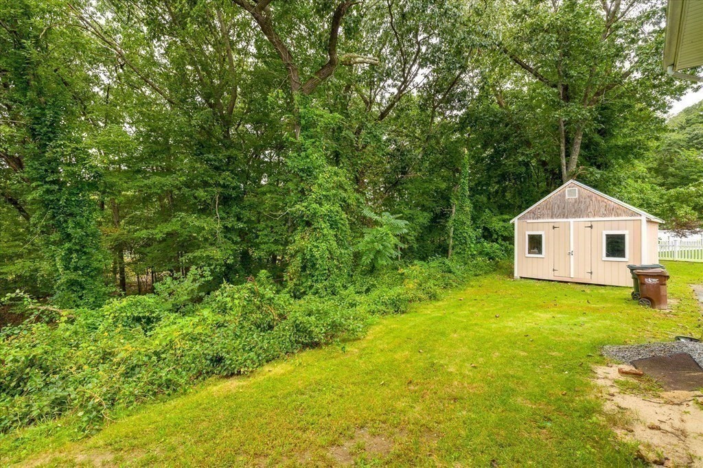 6 Nancy Drive Auburn, MA 01501 - Photo 27 of 27 a yellow house with a yard