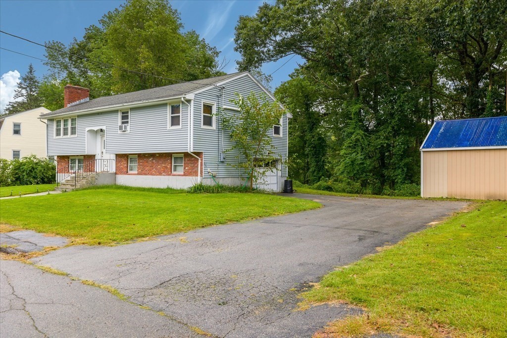 6 Nancy Drive Auburn, MA 01501 - Photo 3 of 27 a front view of house with yard and green space