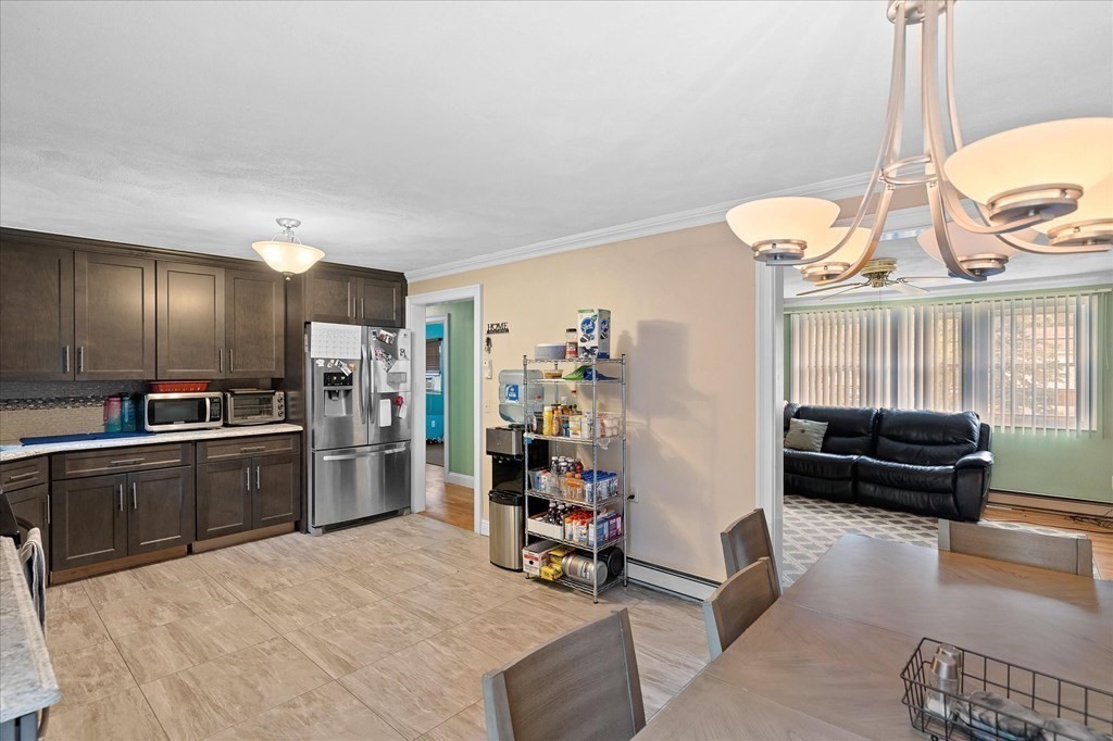 6 Nancy Drive Auburn, MA 01501 - Photo 7 of 27 a kitchen with refrigerator cabinets and furniture