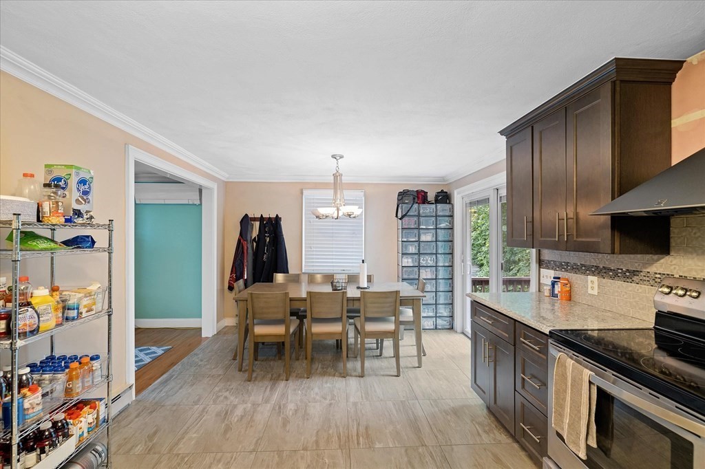 6 Nancy Drive Auburn, MA 01501 - Photo 8 of 27 a kitchen with stainless steel appliances granite countertop a stove and a wooden floors