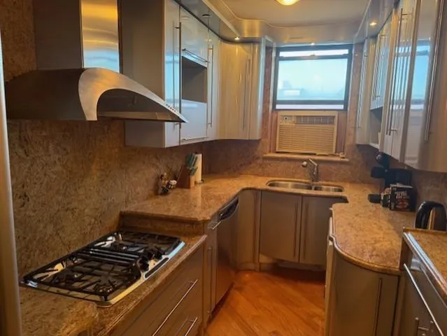 a kitchen with a stove and a sink