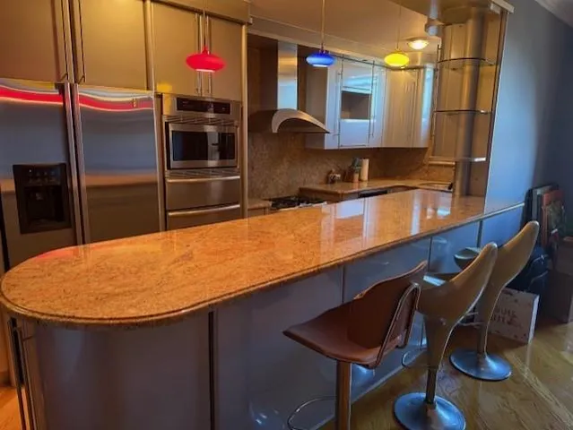 a kitchen with stainless steel appliances granite countertop a sink counter space and cabinets