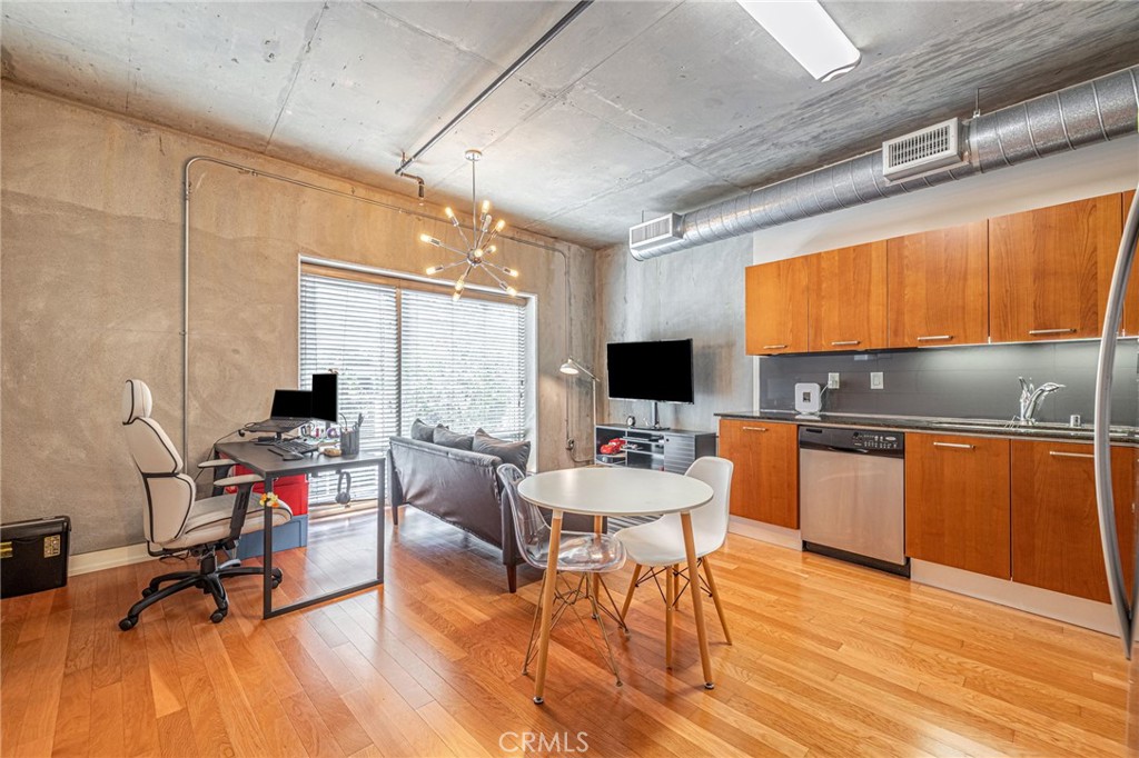 645 West 9th Street, Unit 301 Los Angeles, CA 90015 - Photo 3 of 14 a view of a workspace with furniture and a window