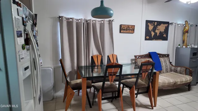 a kitchen with stainless steel appliances a stove a sink and a refrigerator