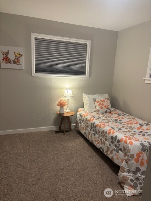 321 3rd Street Northeast Auburn, WA 98002 - Photo 16 of 21 a bedroom with a bed and a wall painting