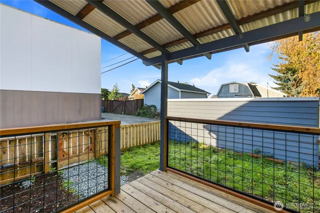 a view of balcony with wooden floor