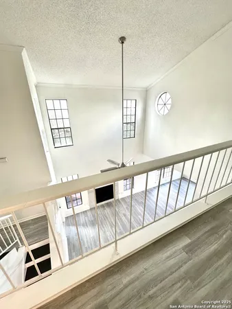 a view of an empty room with windows
