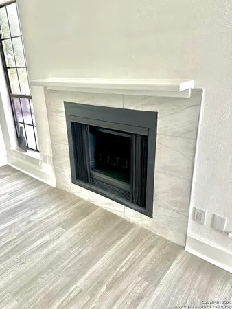 a view of a fireplace in an empty room