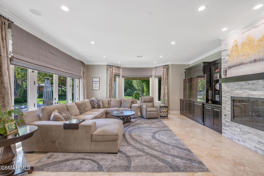 421 Whitegate Road Newbury Park, CA 91320 - Photo 24 of 76 a living room with furniture large window and flat screen tv