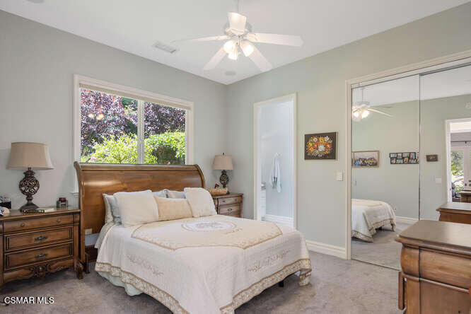 421 Whitegate Road Newbury Park, CA 91320 - Photo 37 of 76 a bedroom with a bed and a chandelier fan