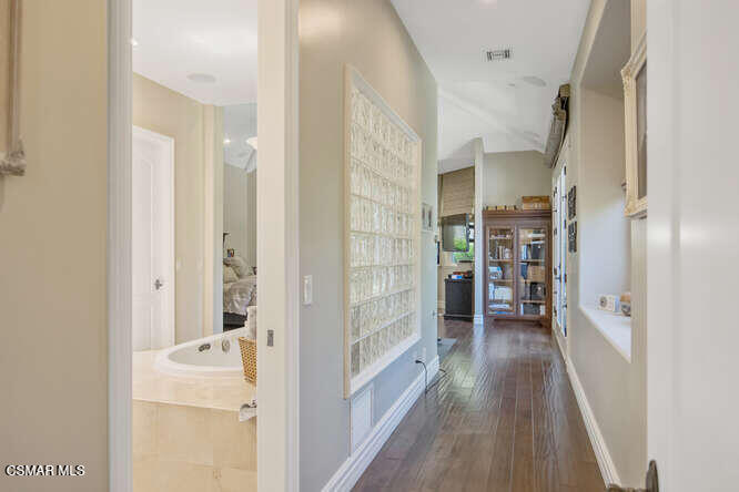 421 Whitegate Road Newbury Park, CA 91320 - Photo 42 of 76 a view of a hallway with wooden floor and staircase