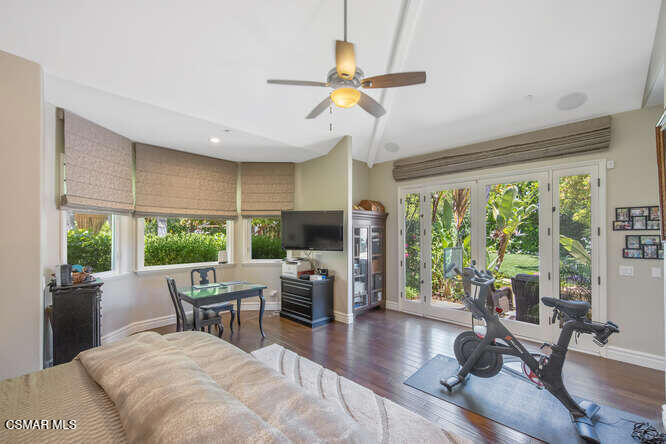 421 Whitegate Road Newbury Park, CA 91320 - Photo 45 of 76 a living room with furniture a flat screen tv and a large window
