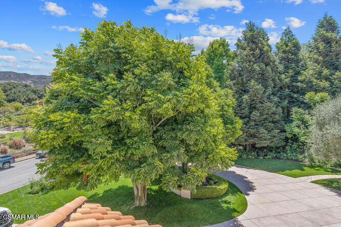 421 Whitegate Road Newbury Park, CA 91320 - Photo 54 of 76 a view of a garden with a building in the background