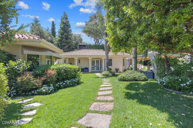 421 Whitegate Road Newbury Park, CA 91320 - Photo 56 of 76 a front view of a house with a yard