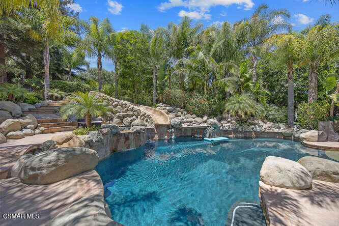 421 Whitegate Road Newbury Park, CA 91320 - Photo 64 of 76 a view of a backyard with lawn chairs and a fire pit