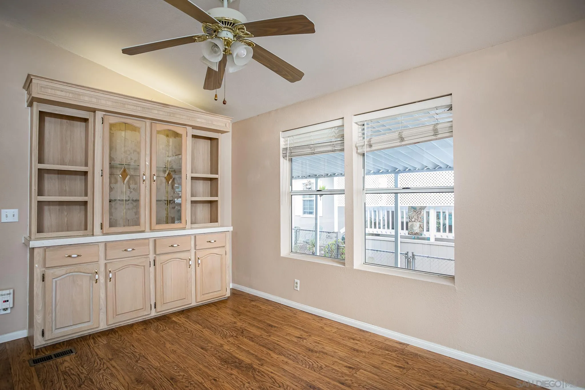 11949 Riverside Drive, Unit SPC 186 Lakeside, CA 92040 - Photo 11 of 40 a view of an empty room with a window and wooden floor