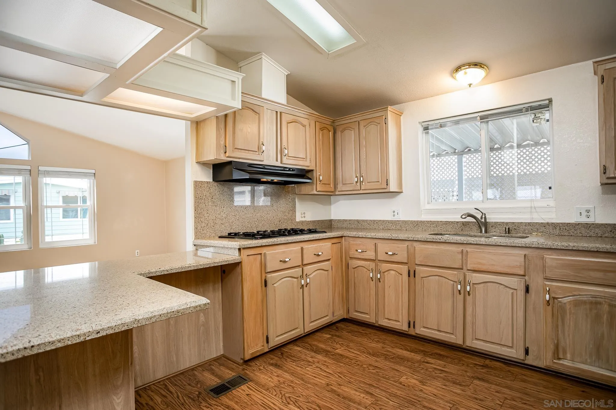 11949 Riverside Drive, Unit SPC 186 Lakeside, CA 92040 - Photo 13 of 40 a kitchen with stainless steel appliances granite countertop a sink stove and cabinets