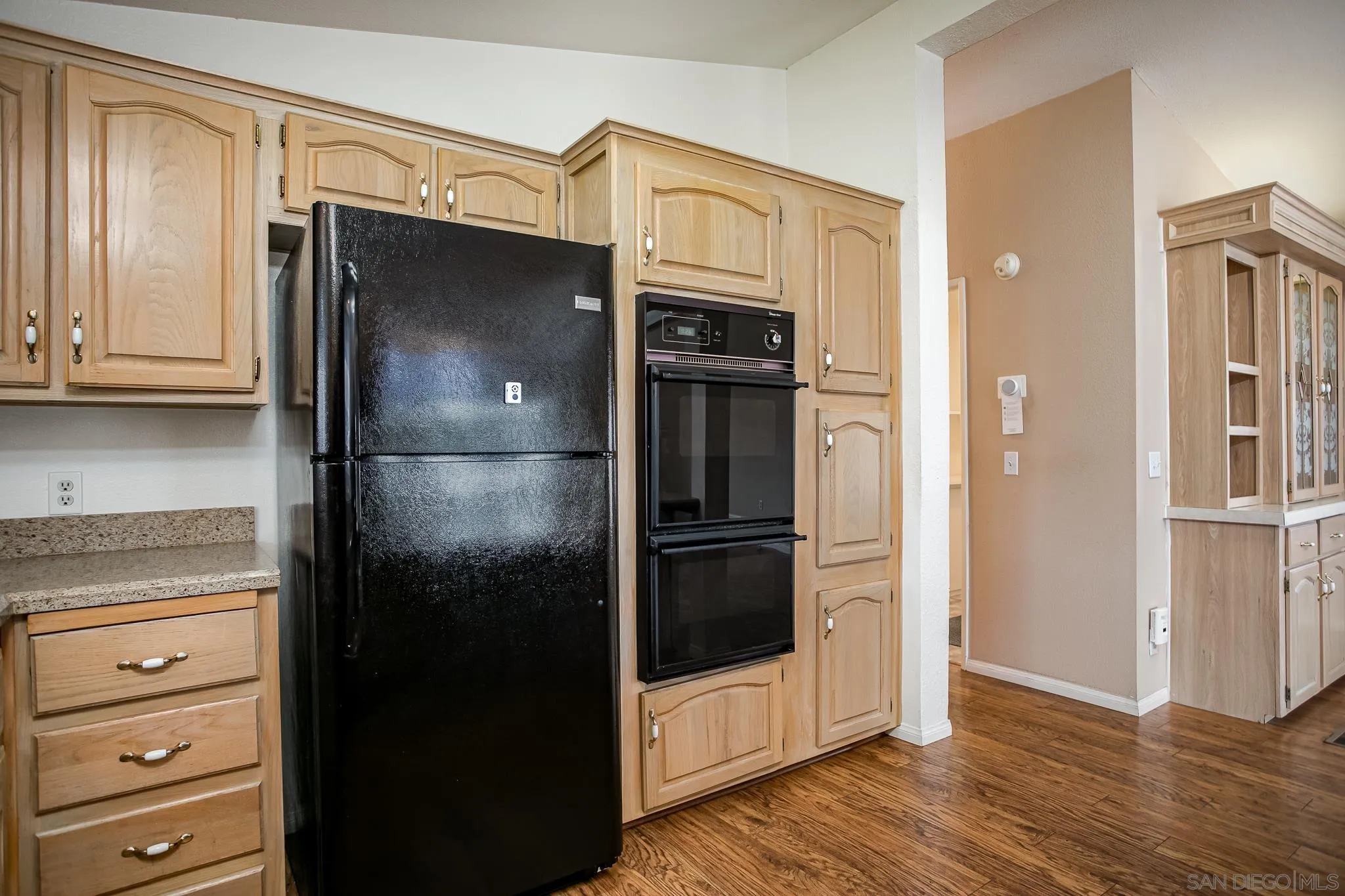 11949 Riverside Drive, Unit SPC 186 Lakeside, CA 92040 - Photo 14 of 40 a kitchen with stainless steel appliances granite countertop a refrigerator and a stove top oven