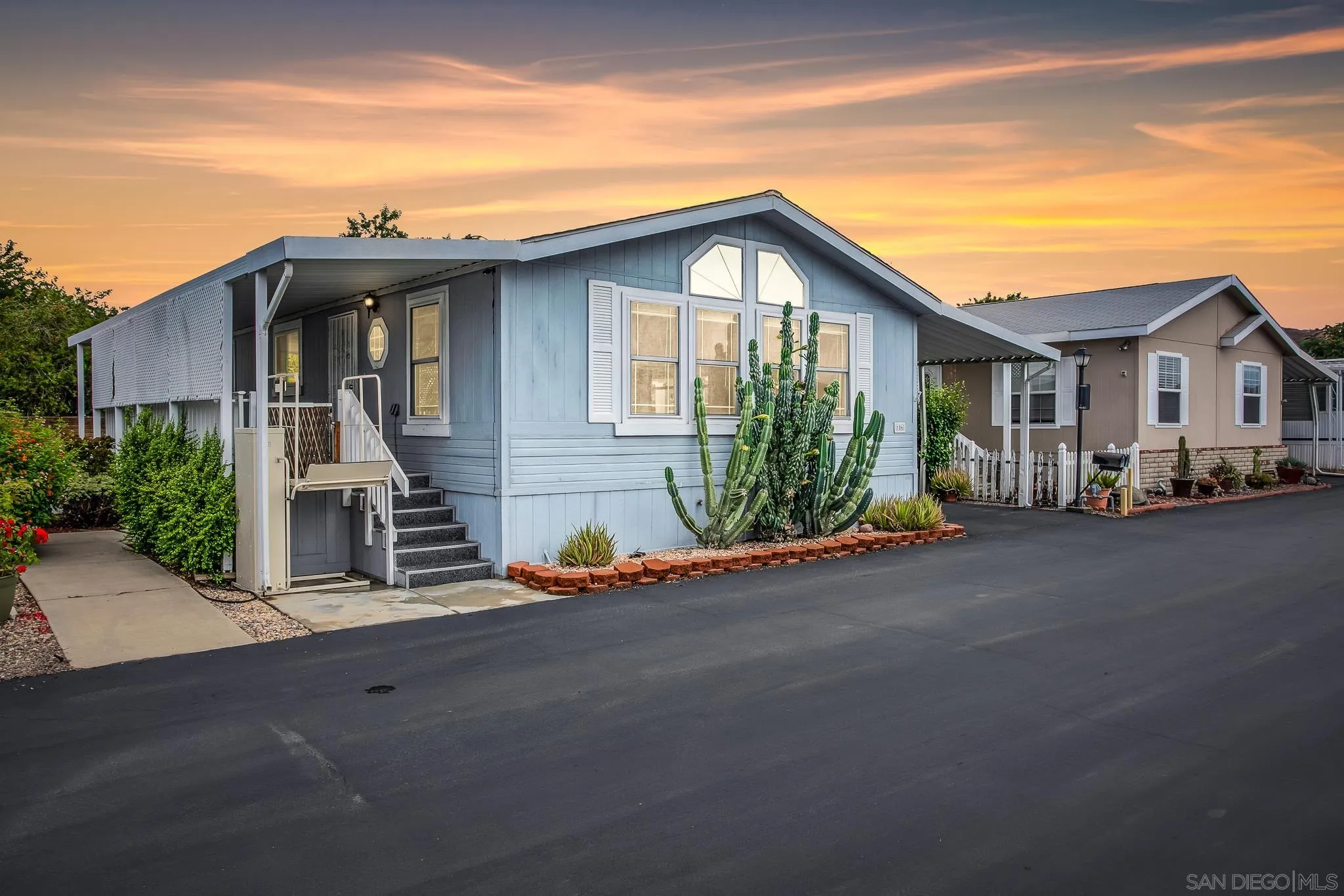 11949 Riverside Drive, Unit SPC 186 Lakeside, CA 92040 - Photo 2 of 40 a view of a house with a small yard and potted plants