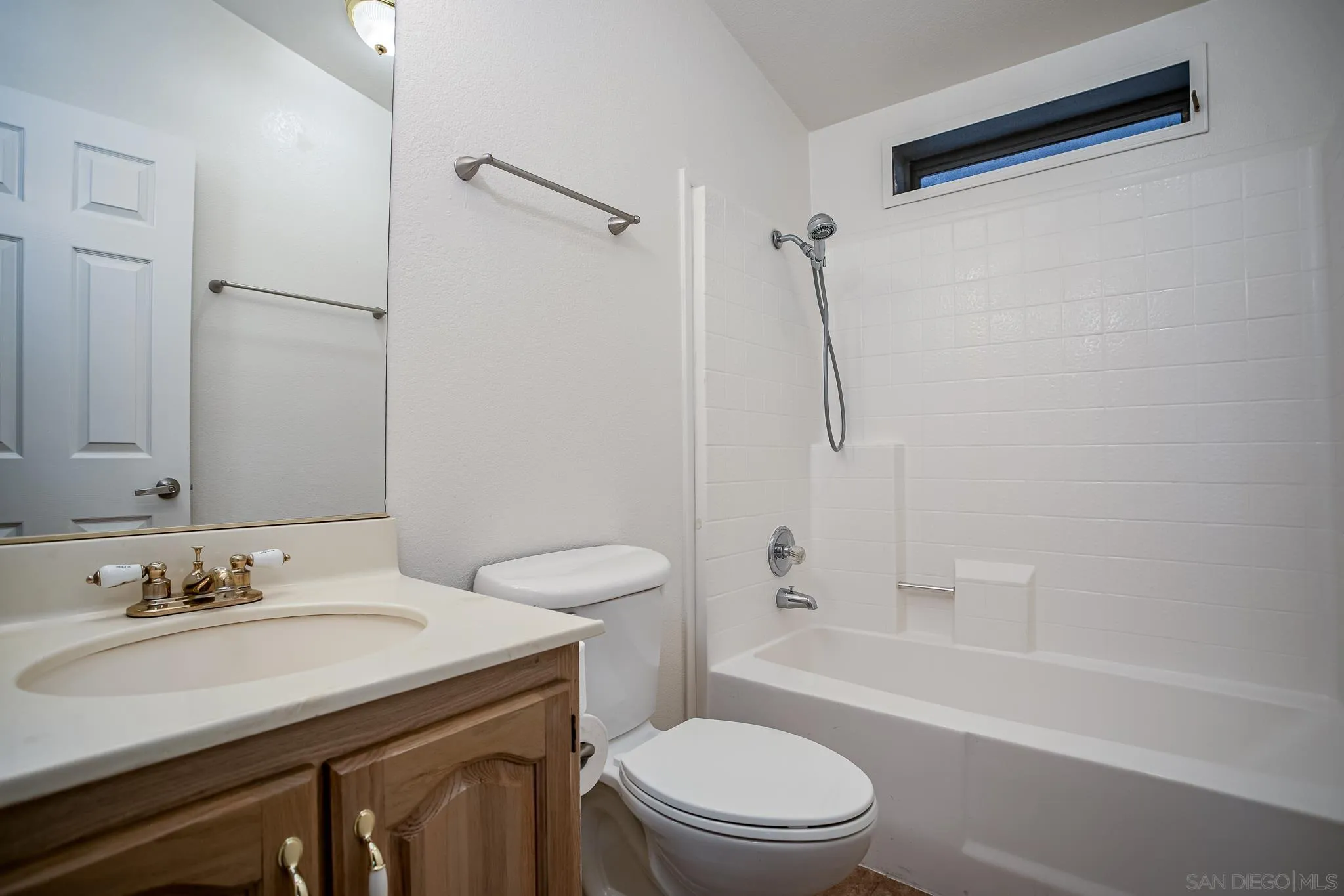 11949 Riverside Drive, Unit SPC 186 Lakeside, CA 92040 - Photo 21 of 40 a bathroom with a sink toilet vanity and shower