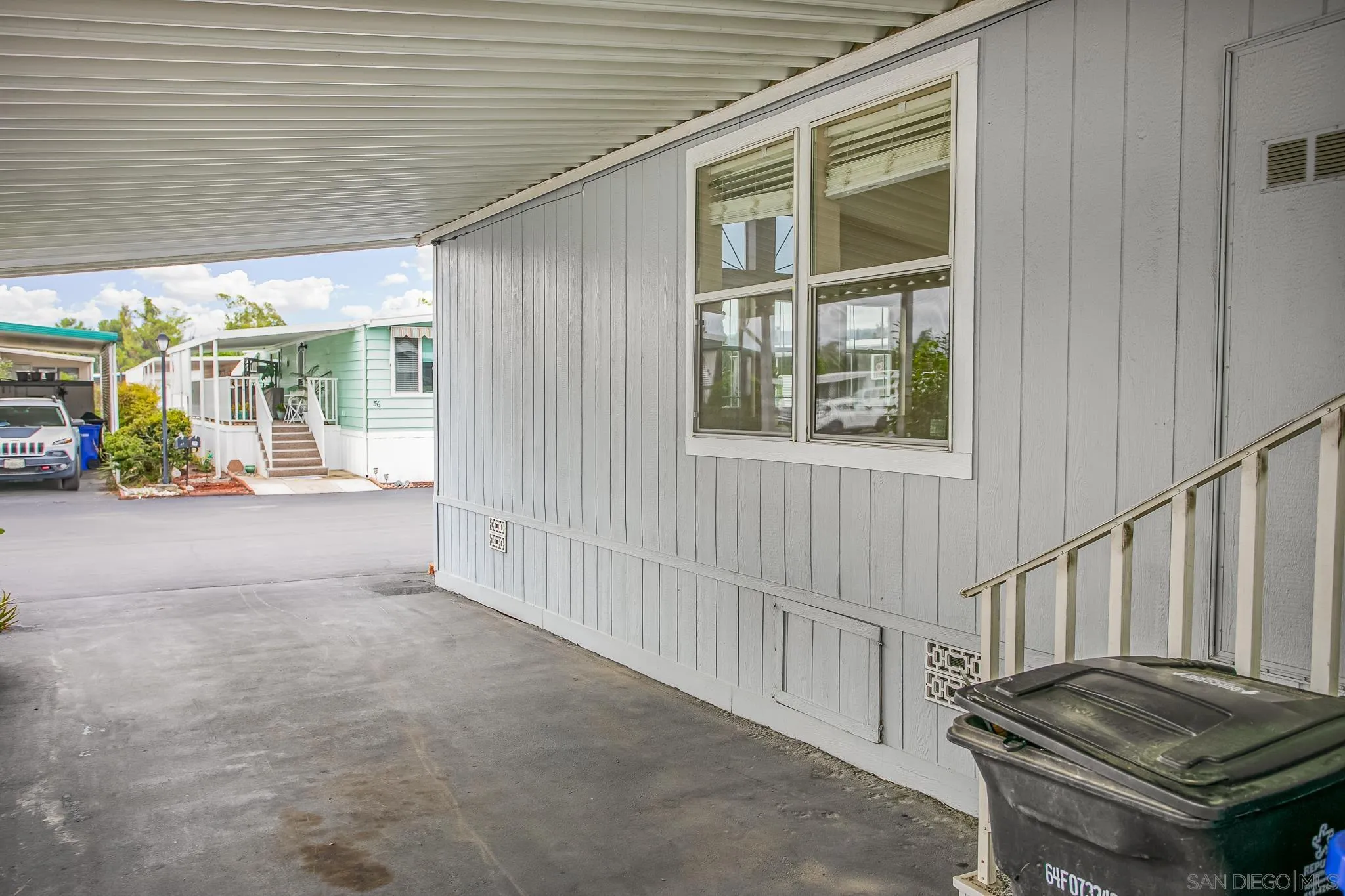 11949 Riverside Drive, Unit SPC 186 Lakeside, CA 92040 - Photo 23 of 40 a view of a hallway with two couches and a barbeque