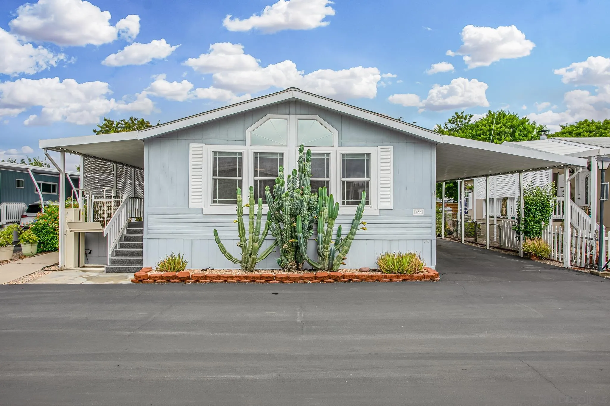 11949 Riverside Drive, Unit SPC 186 Lakeside, CA 92040 - Photo 3 of 40 a front view of house with yard and green space