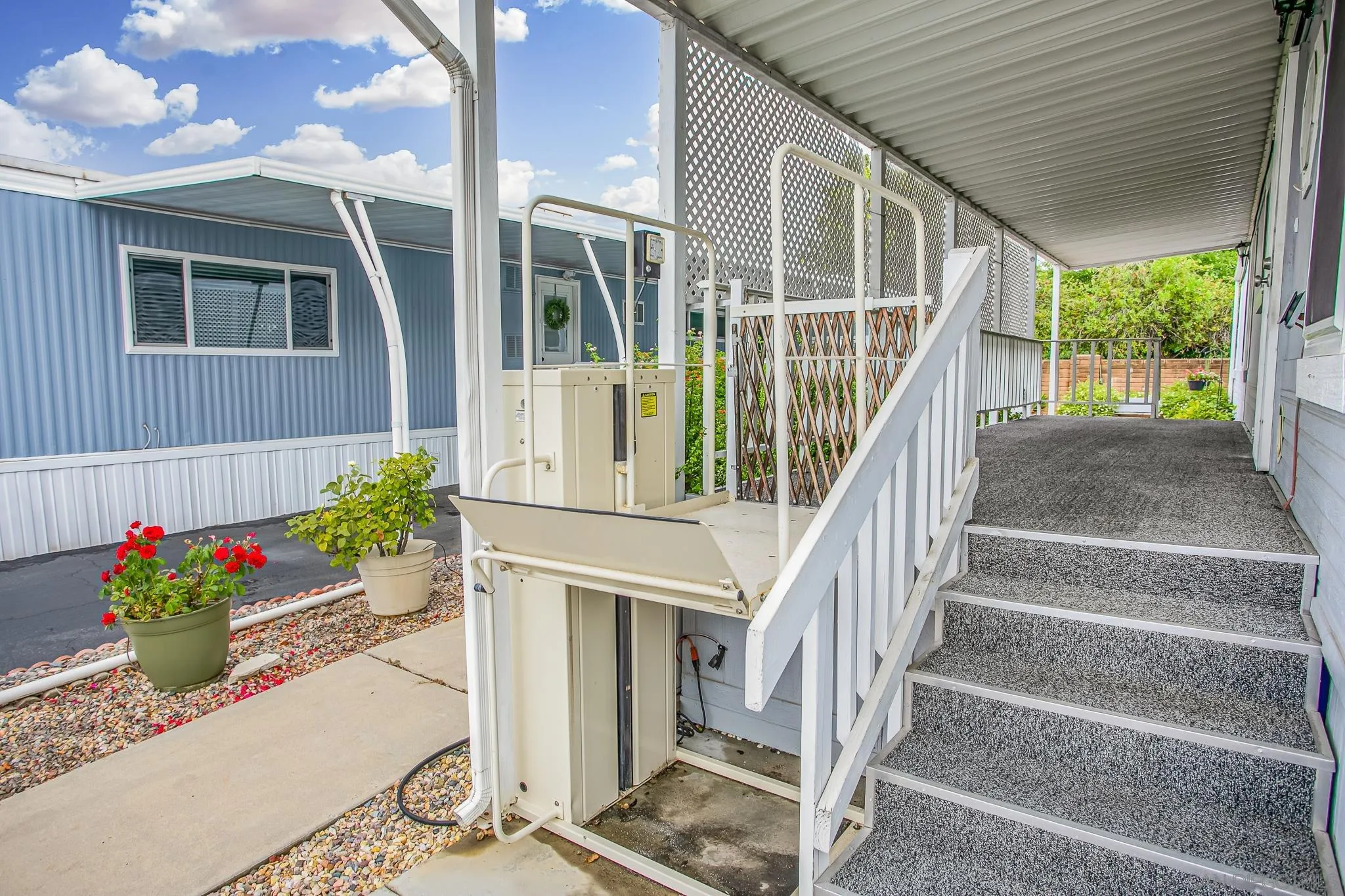 11949 Riverside Drive, Unit SPC 186 Lakeside, CA 92040 - Photo 5 of 40 a view of a house with potted plants