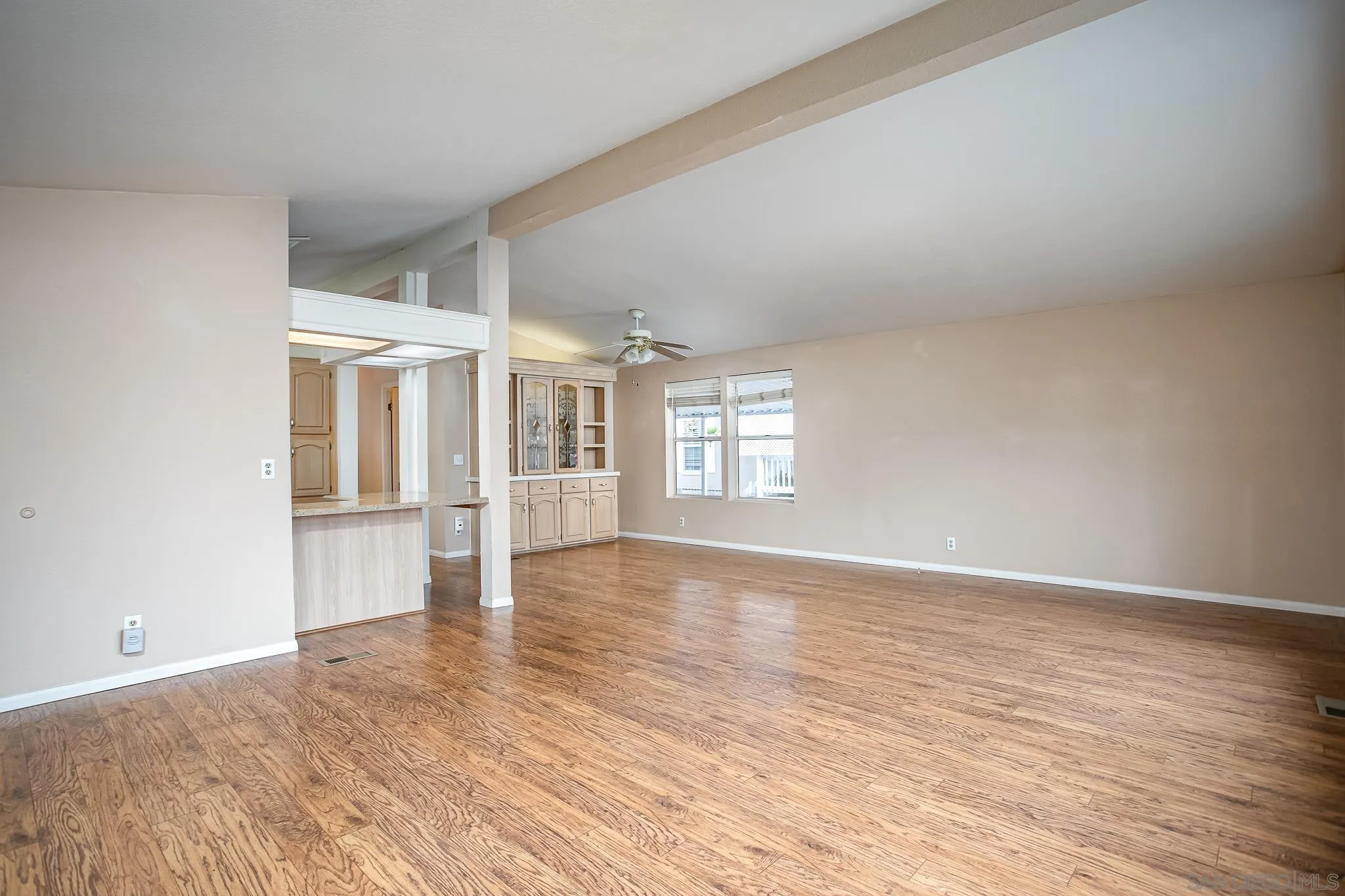 11949 Riverside Drive, Unit SPC 186 Lakeside, CA 92040 - Photo 10 of 40 wooden floor in an empty room with a window