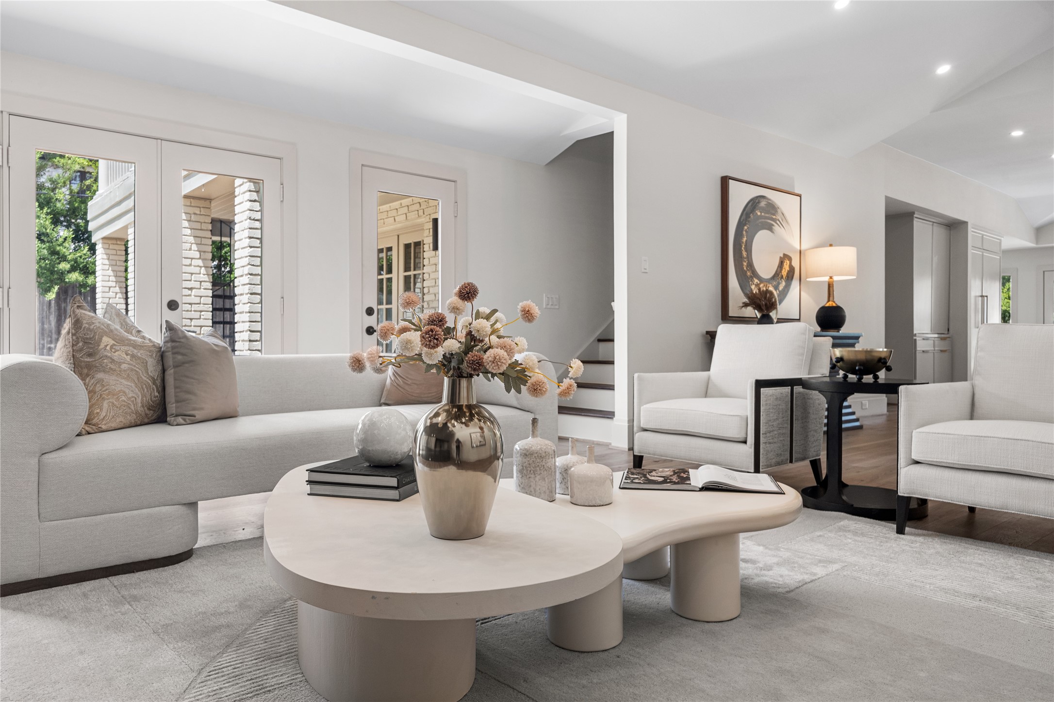 5642 Pine Forest Road Houston, TX 77056 - Photo 11 of 32 Soft textures, oversized windows, and vaulted ceilings create a living room that feels bright from sunrise to sunset. Every finish was chosen to let the architecture remain the focal point.