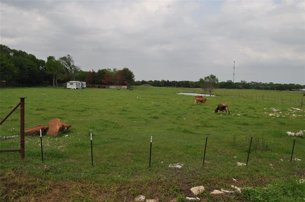 620 South Kaufman Street Seagoville, TX 75159 - Photo 5 of 5 a lake view with a big yard