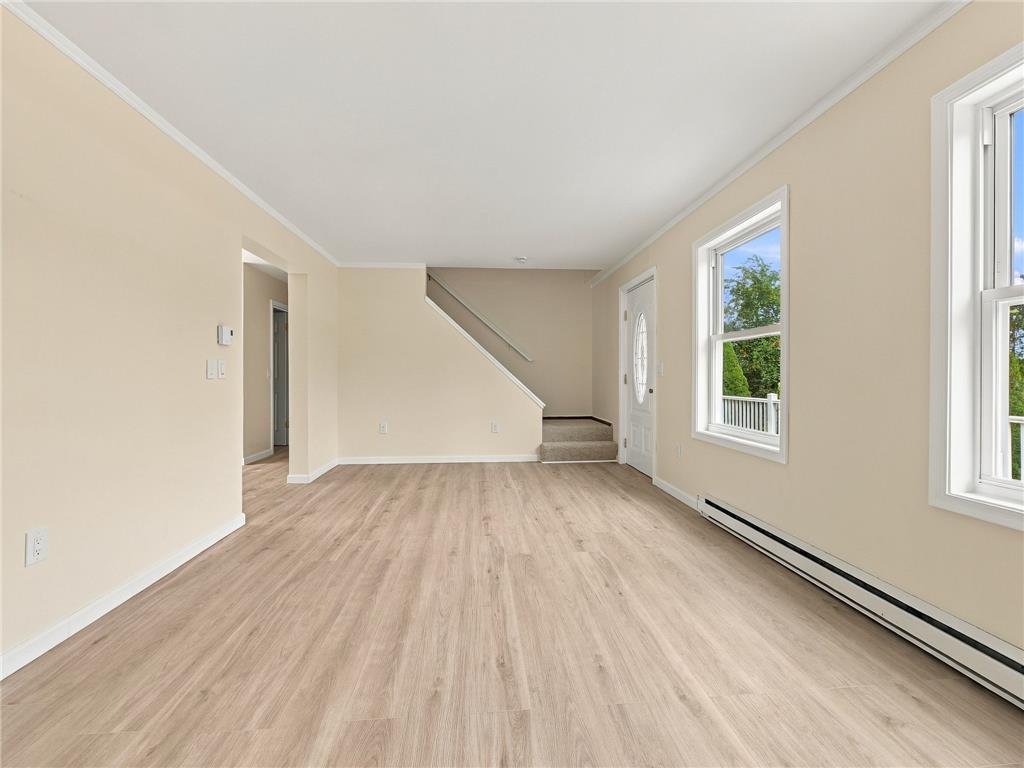 90 Gun Club Road Palmerton, PA 18071 - Photo 22 of 58 Gleaming wood-look floors anchor a welcoming living space illuminated by clean windows.