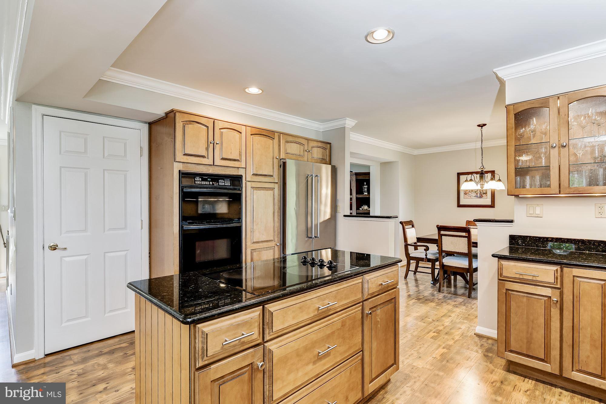 3069 Riverview Road Riva, MD 21140 - Photo 12 of 38 a kitchen with stainless steel appliances granite countertop a stove and a refrigerator