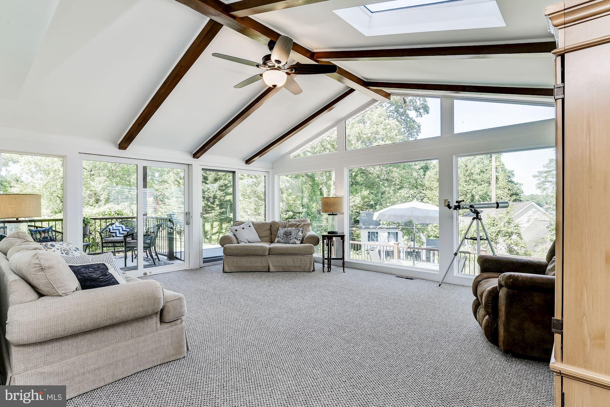 3069 Riverview Road Riva, MD 21140 - Photo 15 of 38 a living room with furniture and a floor to ceiling window