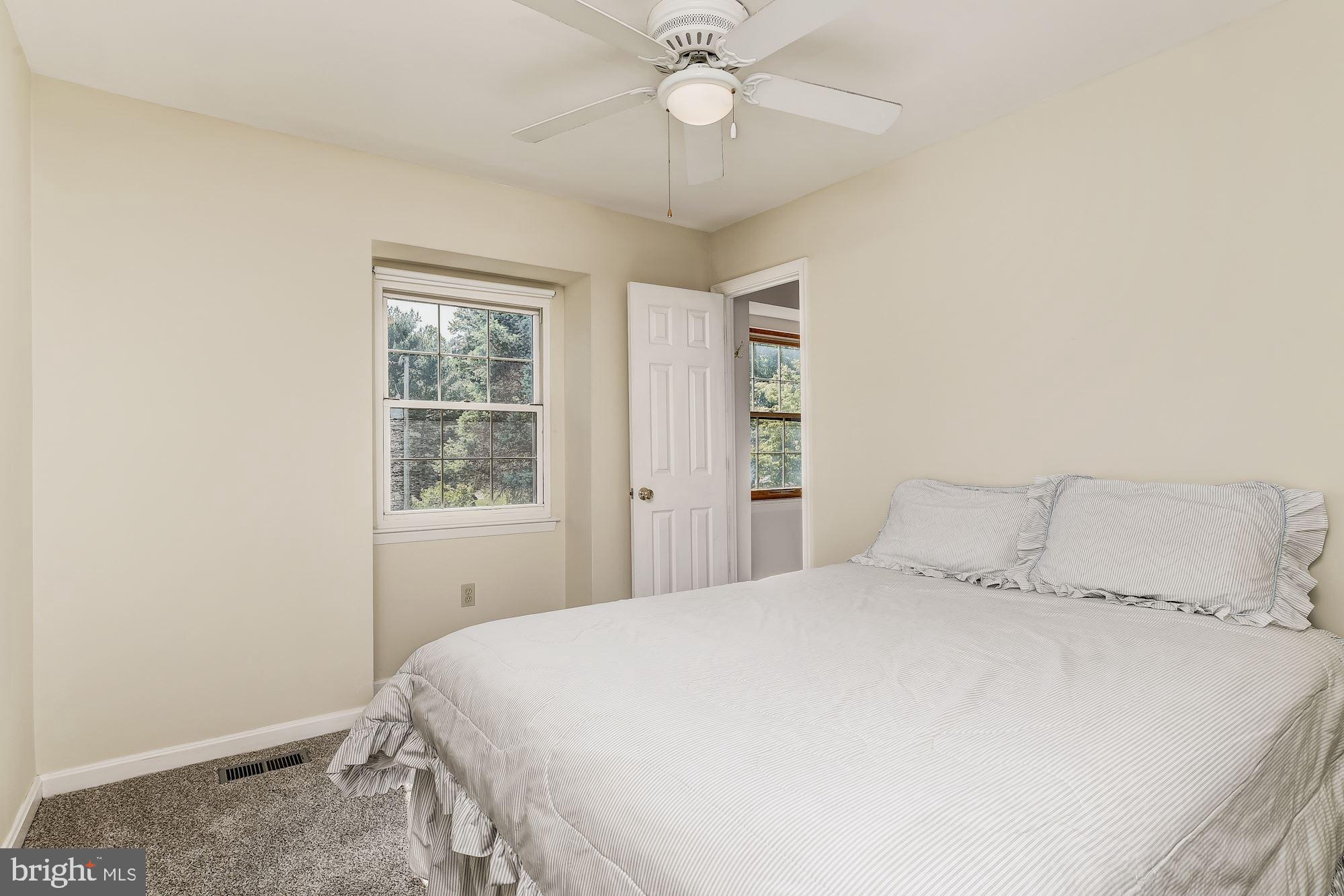 3069 Riverview Road Riva, MD 21140 - Photo 23 of 38 a bedroom with a bed and a chandelier