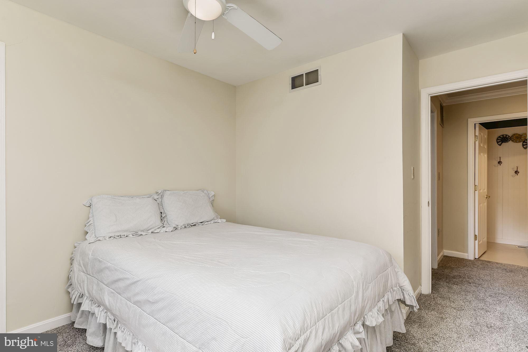 3069 Riverview Road Riva, MD 21140 - Photo 24 of 38 a bedroom with a bed and a window