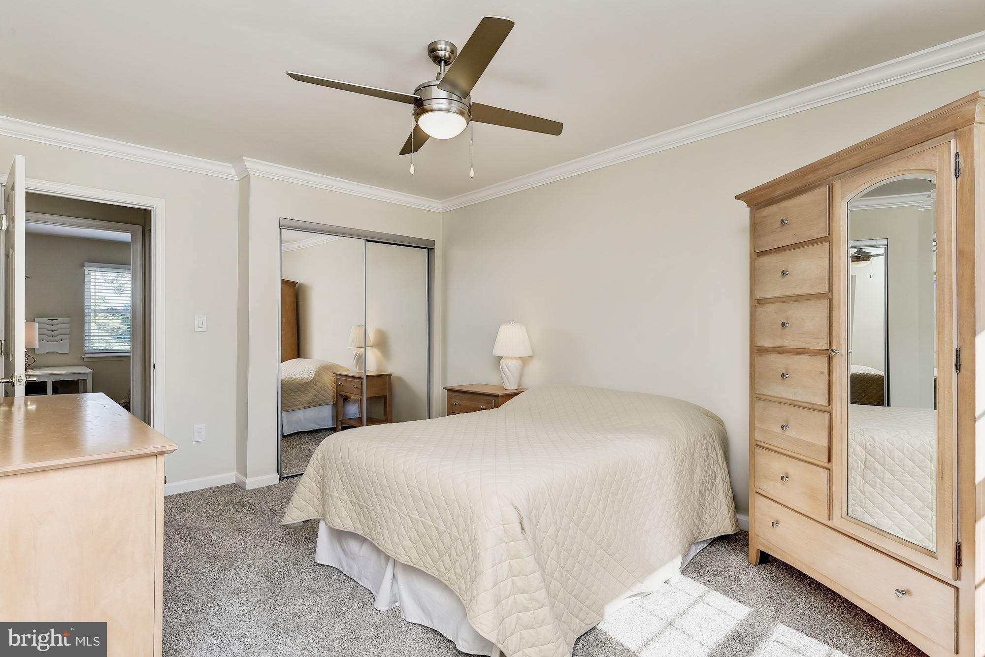 3069 Riverview Road Riva, MD 21140 - Photo 26 of 38 a bedroom with a bed and a refrigerator