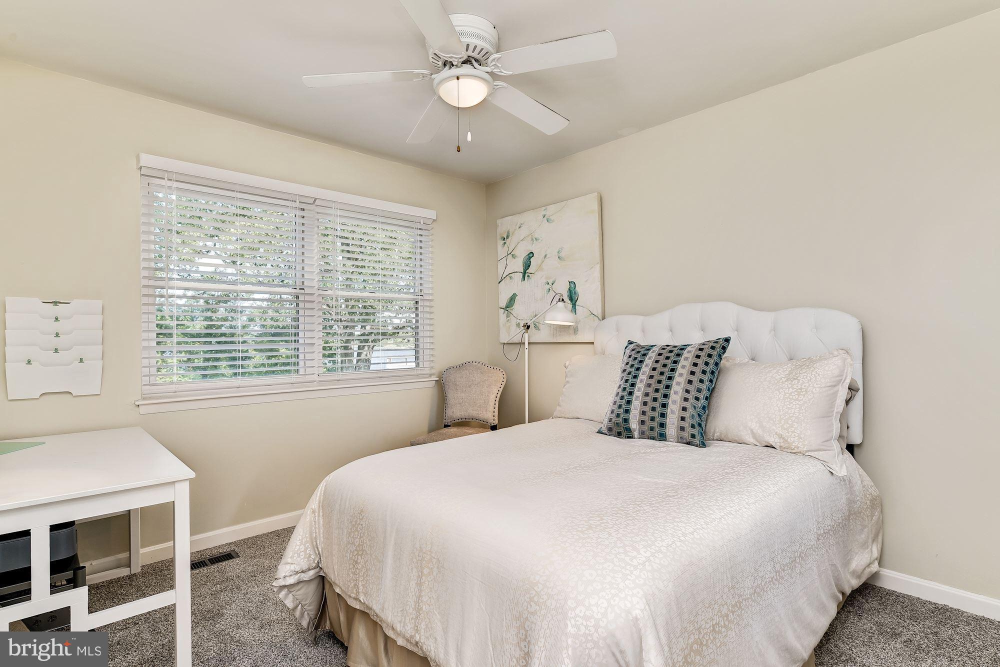 3069 Riverview Road Riva, MD 21140 - Photo 27 of 38 a bedroom with a large bed and a window