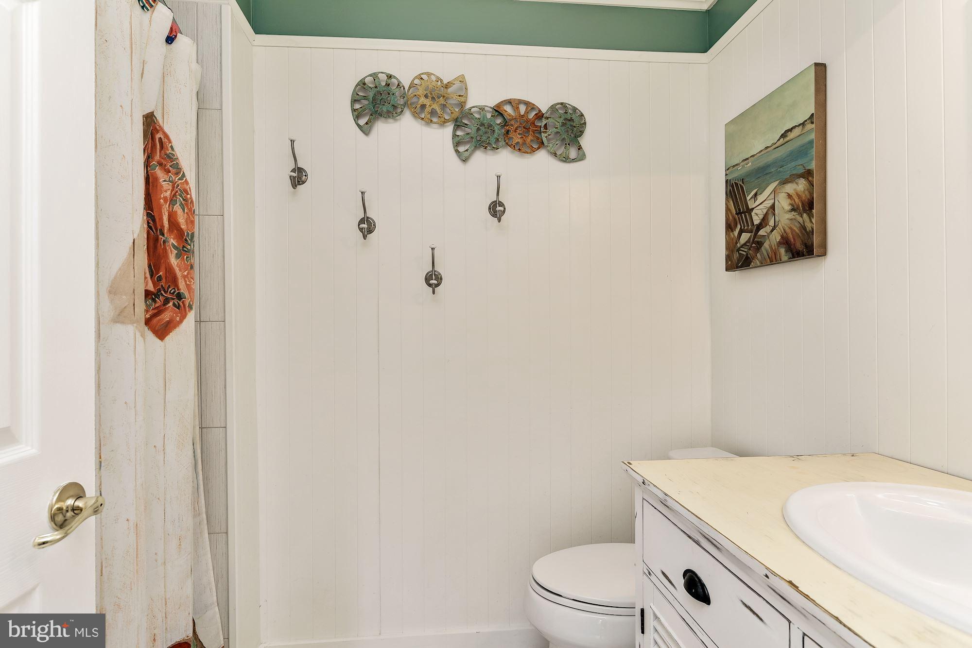 3069 Riverview Road Riva, MD 21140 - Photo 29 of 38 a white toilet sitting next to a bathroom sink
