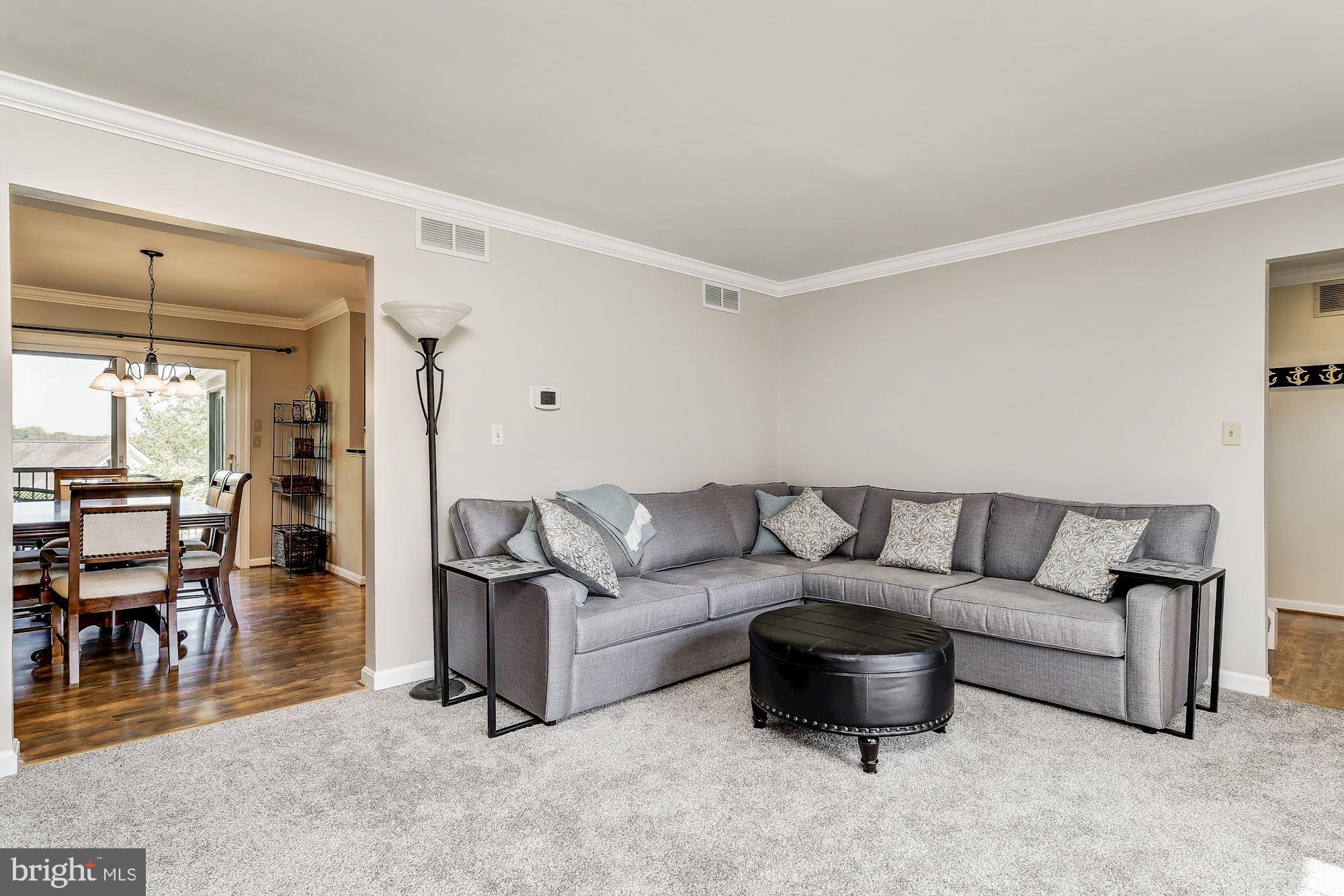 3069 Riverview Road Riva, MD 21140 - Photo 5 of 38 a living room with furniture and a dining table with kitchen view