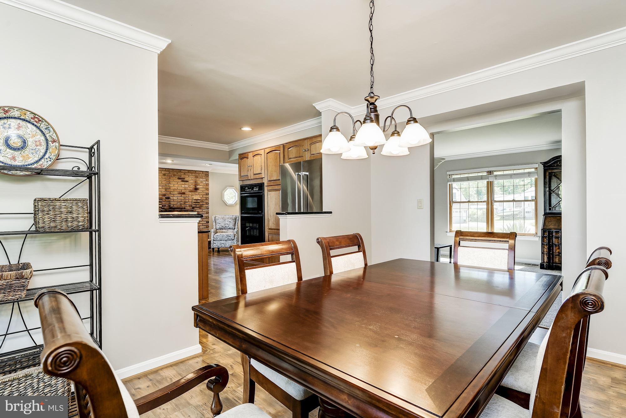 3069 Riverview Road Riva, MD 21140 - Photo 9 of 38 a view of a dining room with furniture and wooden floor