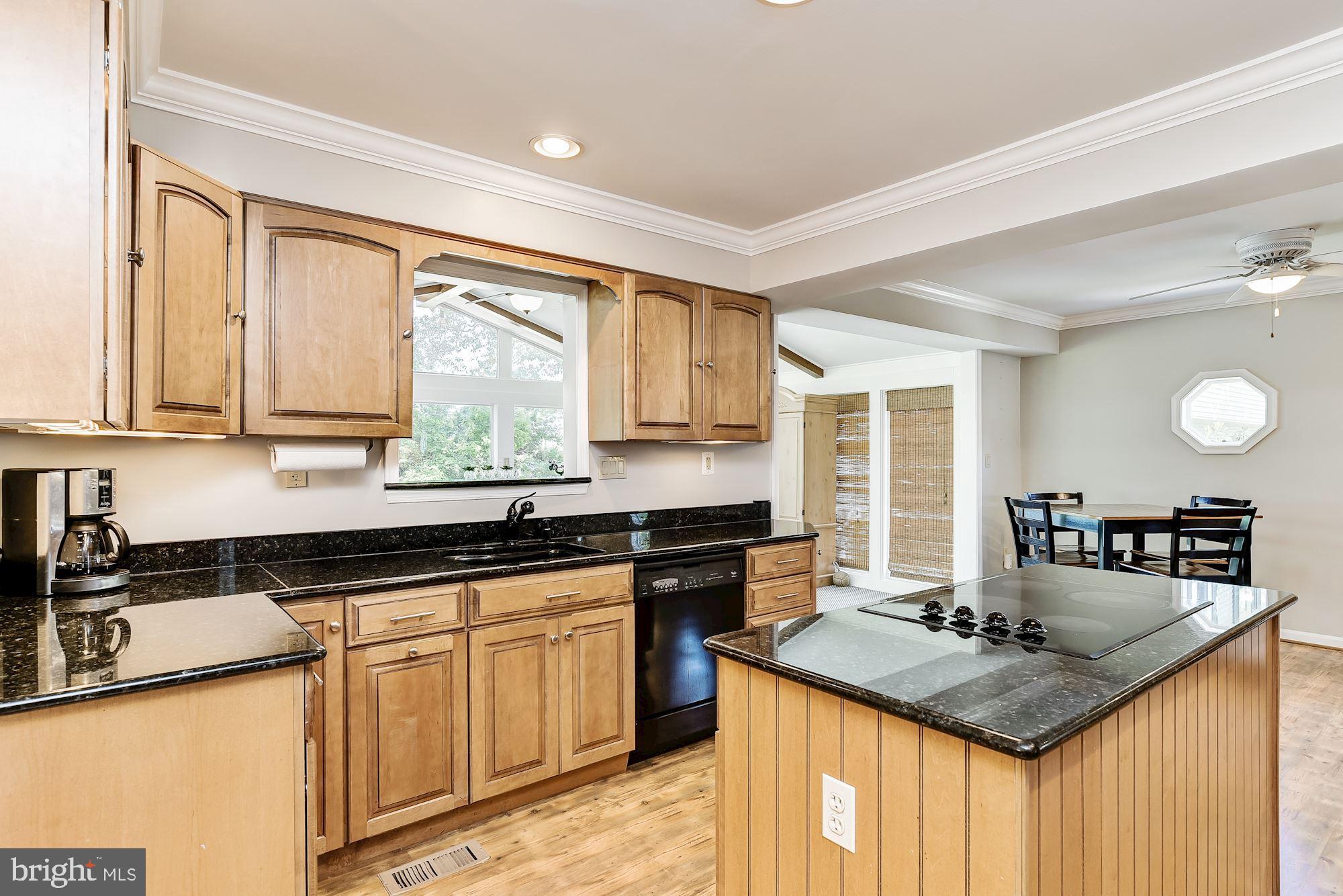 3069 Riverview Road Riva, MD 21140 - Photo 10 of 38 a kitchen with granite countertop a sink a counter space appliances and cabinets