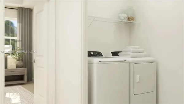 a utility room with dryer and washer