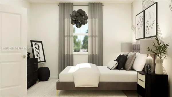 a bedroom with a bed and a painting on the wall