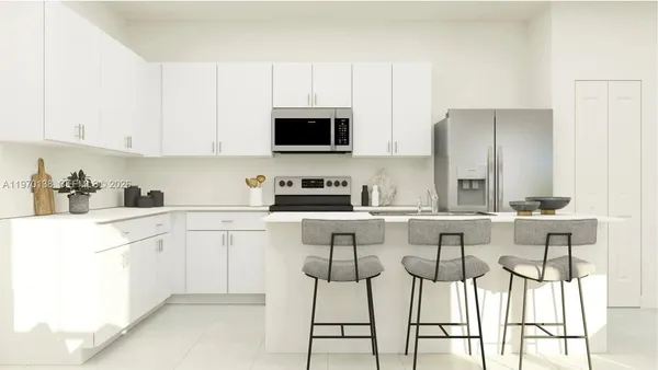 a kitchen with stainless steel appliances kitchen island granite countertop a sink and cabinets